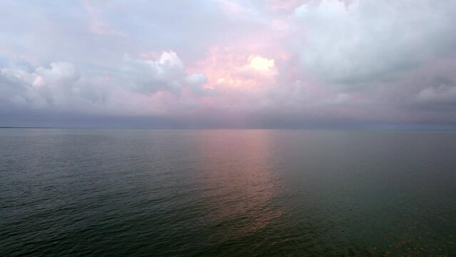 The dramatic twilight sky over the beach. sea and ocean stock videos.
