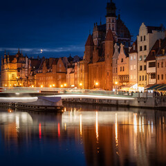 Old town in Gdansk with historicalarchitecture by the Motlawa river at night, Poland.