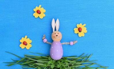 Art baby Easter bunny on spring green grass