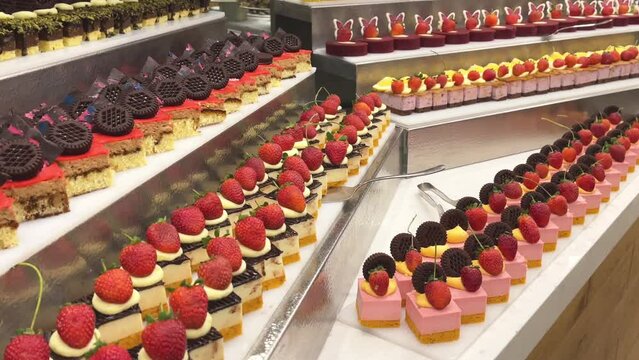 A table with a variety of desserts in the hotel. 