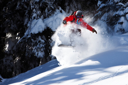 A snowboarder rips untracked powder turns in Colorado.