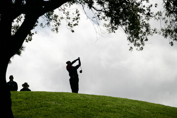 A golfer hits golf ball, La Jolla, California.
