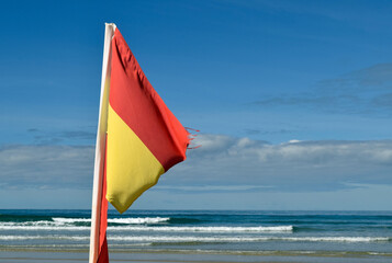 Swimming safety flag meaning lifeguard on duty, Jersey, Channel Islands, UK