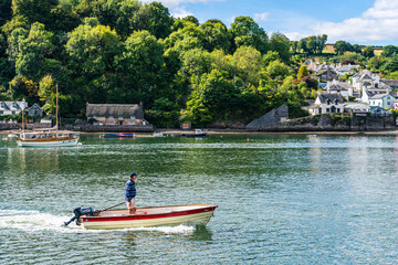 Fototapeta na wymiar Boats and Yachts on River Dart over Dittisham and Greenway Quay, Devon, England
