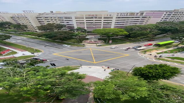 Singapore 2022Aug Time lapse video of cars and traffic in Singapore. High angle street view of box junction in HDB heartland
