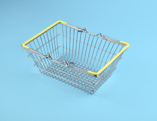 Close up of empty chrome wire basket on blue background for online shopping concept