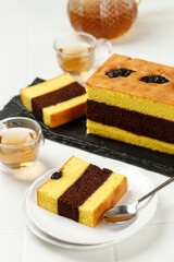 Sliced Spiku or Lapis Surabaya, Indonesian Three Layer Cake with with Strawberry Jam Between