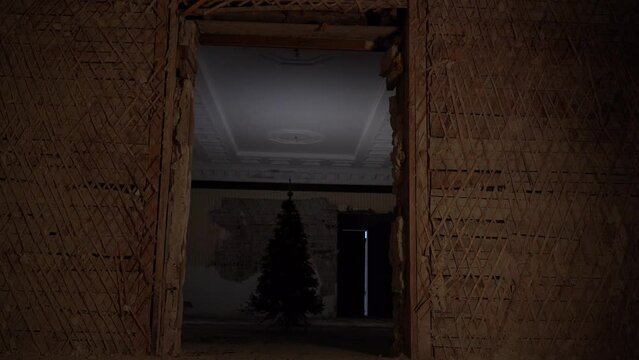 Kharkiv, Ukraine - December 2022: Christmas tree in the destroyed building of the regional council of the Kharkiv region.
