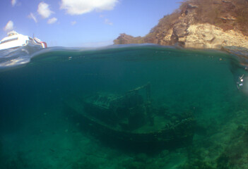 a small sunken ship on the island of Curaçao