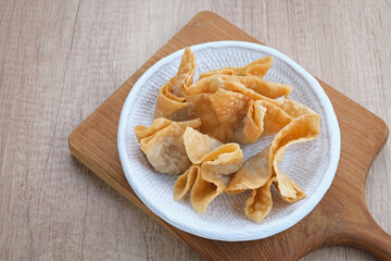 Pangsit Goreng (Chicken Fried Dumpling), Indonesian Traditional Food. Served with sauce
