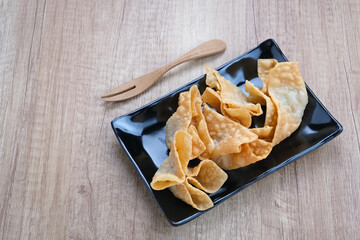 Pangsit Goreng (Chicken Fried Dumpling), Indonesian Traditional Food. Served with sauce
