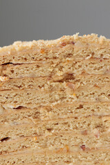 Piece Of Layered Homemade Honey Cake on the white table