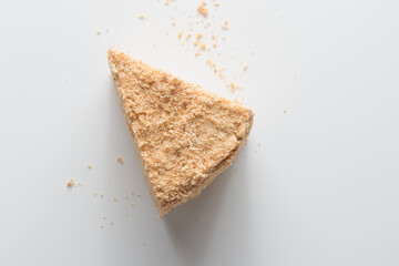 Piece Of Layered Homemade Honey Cake on the white table