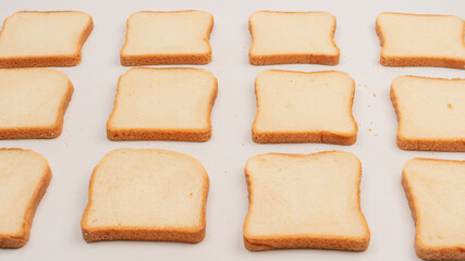 Delicious bread slices isolated on a white background, top view.