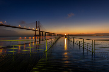 Fototapeta na wymiar Sunrise in Vasco da Gama bridge Lisbon Portugal