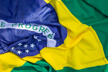 Bandeira amassada do Brasil. Foto tirada no evento de posse do novo presidente do Brasil. - obrazy, fototapety, plakaty