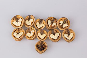 Half a walnut with a heart shape in the middle. The concept of love for nuts. Good and evil. Valentine's Day.