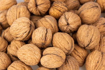 Walnut in shell isolated on white background. Energy boost for the day. The concept of proper nutrition. Tasty breakfast.