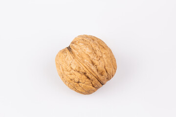 Walnut in shell isolated on white background. Energy boost for the day. The concept of proper nutrition. Tasty breakfast.