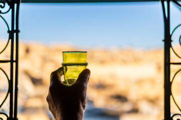 Glass for Moroccan mint tea on the background of old medina in Fez, Morocco, North Africa