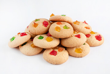 On a white background cookies with candied fruits.