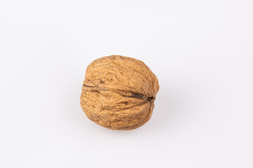 Walnut in shell isolated on white background. Energy boost for the day. The concept of proper nutrition. Tasty breakfast.