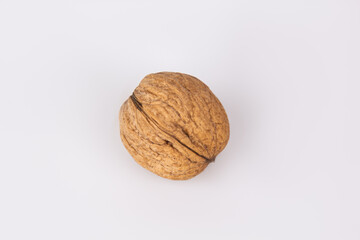 Walnut in shell isolated on white background. Energy boost for the day. The concept of proper nutrition. Tasty breakfast.