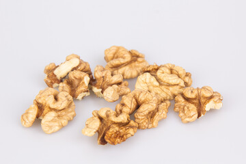 Half a walnut isolate. Peeled walnut on white. Walnut top view. Set with clipping path. Full depth of field.