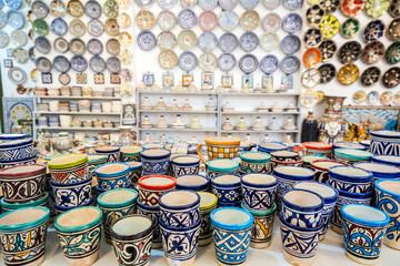 Shelves full of handmade ceramic products in pottery factory in Fez, Morocco, Africa