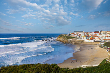 Lighthouse in the rocky cliffs of the portuguese beach of Sao Pedro de Moel. West coast of Portugal