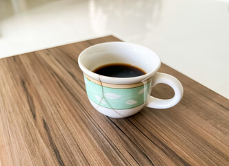 cup of coffee on wooden table
