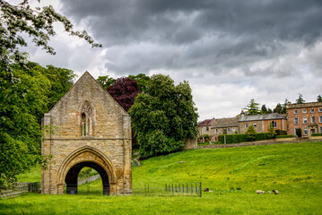 stone building with Yorkshire Dales United Kingdom in the background