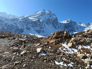 Panoramic landscape view of the majestic snowcapped great Himalayas mountain range on a winter day. They are famous for tourism in Sikkim, India