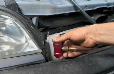 Refueling car air conditioner with special equipment. Refueling car freon, maintenance and repair...