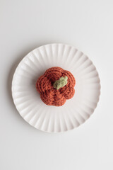 Crocheted pumpkins on a white table