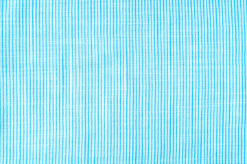 Obraz premium Natural linen texture as background. Cotton fabric with turquoise and white line striped pattern, texture close up, top vies, flat lay. Backdrop wallpaper. Matereal for clothes, curtain and upholstery