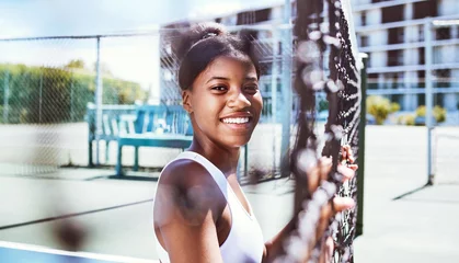 Fotobehang Fitness, fence or portrait of black woman on a tennis court relaxing on training, exercise or workout break in summer. Happy, sports athlete or healthy African girl ready to play a fun match or game © Emily N/peopleimages.com