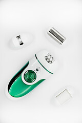 Women's electric razor for intimate places. A set of women's razor for hair on a white background....