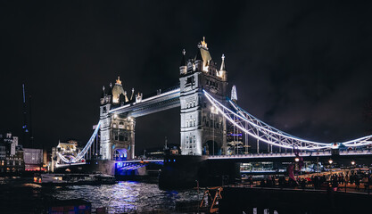 Fototapeta na wymiar Night landscape with Tower Bridge landmark building. Celebration of the New Year Eve in London.