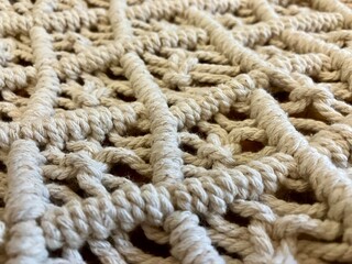 hand made macrame texture pattern. ECO friendly modern knitting DIY natural decoration concept. Flat lay.