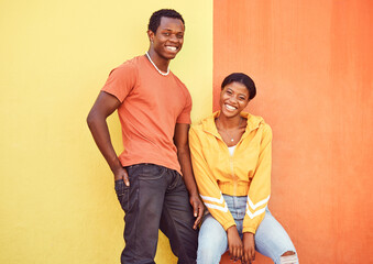 Black couple, smile and urban portrait by wall with edgy fashion, happy and bonding with color. Gen...