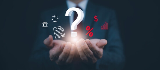 Tax with Ask question online concept, Businessman hold interface question marks tax payment...