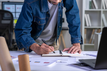 Graphic designer drawing sketches logo design. The concept of a new brand. Professional creative...