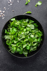 fresh green salad mache leaves healthy meal food snack on the table copy space food background...