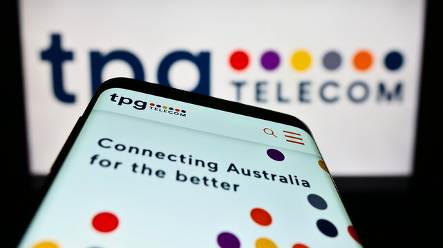 Stuttgart, Germany - 12-30-2022: Mobile phone with website of Australian company TPG Telecom Limited on screen in front of business logo. Focus on top-left of phone display.