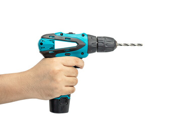 Hand holding green cordless drill
