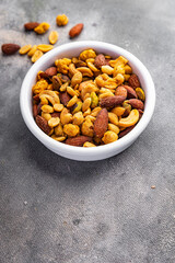 nut salt snack mix almond, cashew, pistachio, peanut fresh nuts food on the table copy space food background rustic top view
