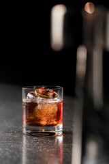 Old fashioned whiskey drink on ice