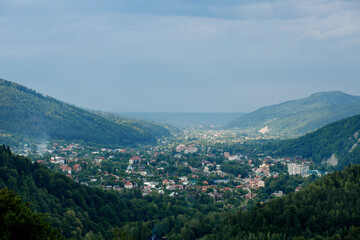 Fototapeta na wymiar A small village among the mountains in the Carpathians. Mountain landscape