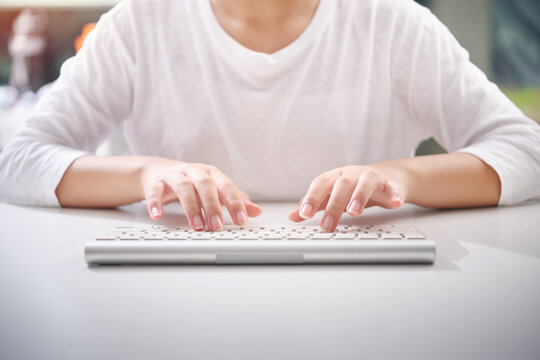 Hand of woman are using a computer keyboard to Searching for information. Hand typing keyboard. Data Search Technology Search Engine website Optimization concept.